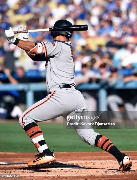 Jae-Gyun Hwang of the San Francisco Giants hits against pitcher Hyun-Jin Ryu of the Los Angeles Dodgers during the second inning at Dodger Stadium...