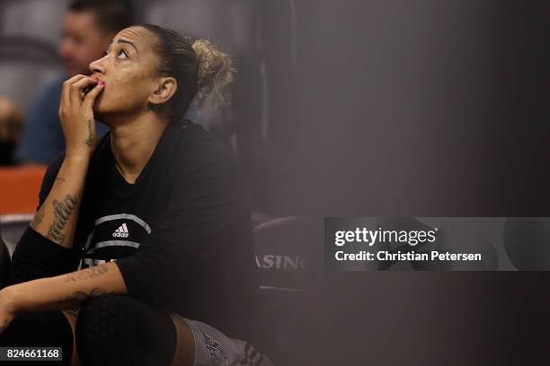 Erika de Souza of the San Antonio Stars watches from the bench during the second half of the WNBA game against the Phoenix Mercury at Talking Stick...