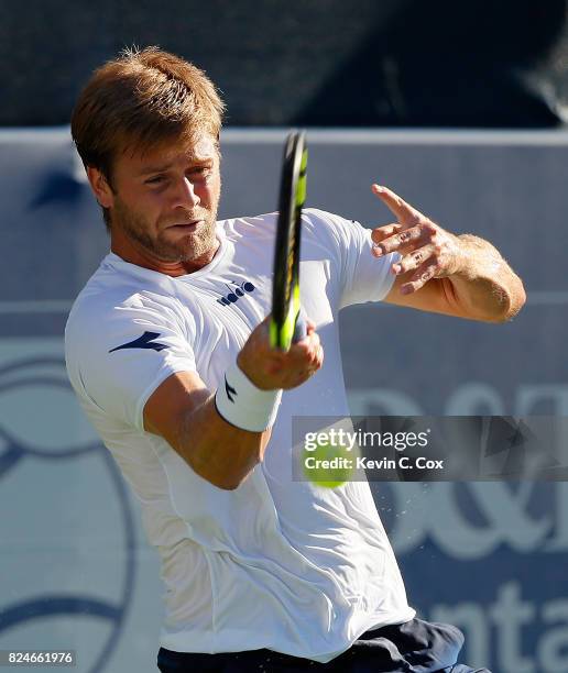 Ryan Harrison returns a forehand to John Isner during the BB&T Atlanta Open at Atlantic Station on July 30, 2017 in Atlanta, Georgia.