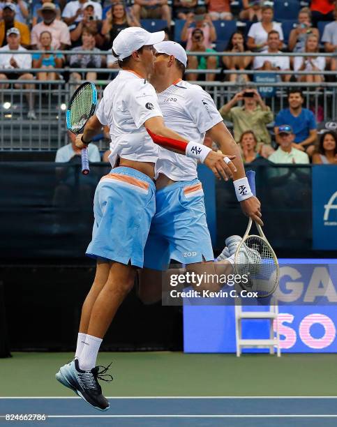 Bob and Mike Bryan celebrate after defeating the Wesley Koolhof of the Netherlands and Artem Sitak of New Zealand during the BB&T Atlanta Open at...