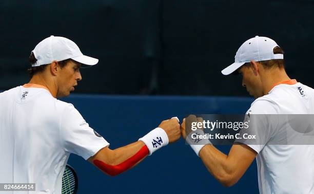 Bob and Mike Bryan react during the match against Wesley Koolhof of the Netherlands and Artem Sitak of New Zealand during the BB&T Atlanta Open at...