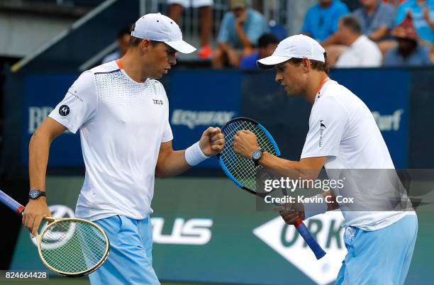 Bob and Mike Bryan react during the match against Wesley Koolhof of the Netherlands and Artem Sitak of New Zealand during the BB&T Atlanta Open at...