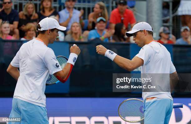 Bob and Mike Bryan react during the match against Wesley Koolhof of the Netherlands and Artem Sitak of New Zealand during the BB&T Atlanta Open at...