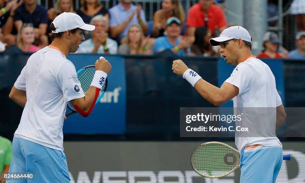 Bob and Mike Bryan react during the match against Wesley Koolhof of the Netherlands and Artem Sitak of New Zealand during the BB&T Atlanta Open at...