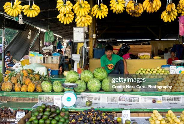 fruit vendor waiting for customer - snake fruit stock pictures, royalty-free photos & images