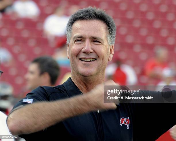 General manager Bruce Allen of the Tampa Bay Buccaneers watches warmups against the New England Patriots at Raymond James Stadium on August 17, 2008...