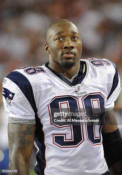 Linebacker Shawn Crable of the New England Patriots watches play against the Tampa Bay Buccaneers at Raymond James Stadium on August 17, 2008 in...