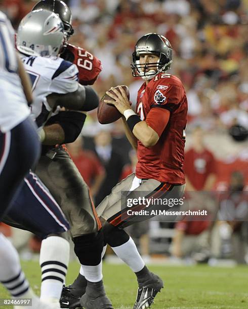 Quarterback Luke McCown of the Tampa Bay Buccaneers sets to pass against the New England Patriots at Raymond James Stadium on August 17, 2008 in...