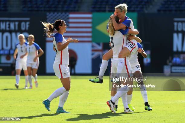 Kelley O'Hara, Megan Rapinhoe, and Becky Sauerbrunn of the United States celebrate a goal against Brazil during the first half of a match in the 2017...