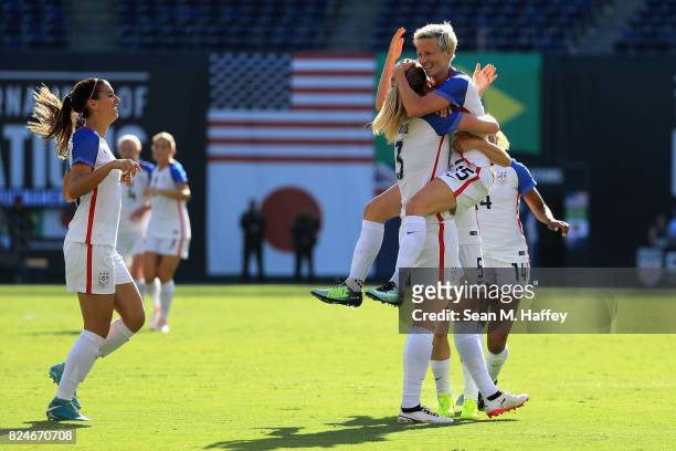 Kelley O'Hara, Megan Rapinhoe, and Becky Sauerbrunn of the United States celebrate a goal against Brazil during the first half of a match in the 2017...