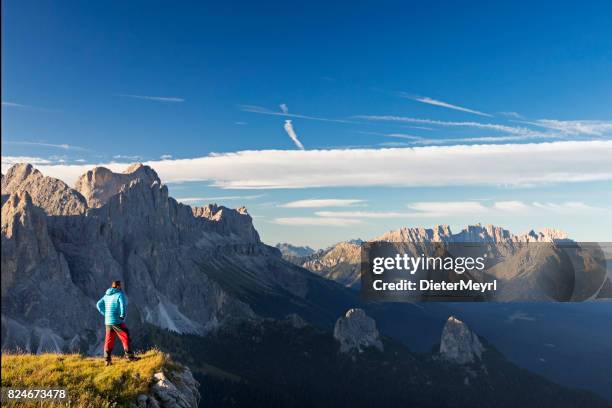 hiker at catinaccio, rosengarten mountain group, dolomites - catinaccio rosengarten stock pictures, royalty-free photos & images