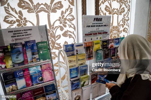 Visitor browses religious reading materials at the Crystal Mosque in Kuala Terengganu, Terengganu, Malaysia, on Monday, July 23, 2017. With a federal...