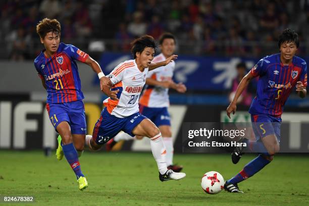Go Hayama of Albirex Niigata and Yu In Soo of FC Tokyo compete for the ball during the J.League J1 match between FC Tokyo and Albirex Niigata at...