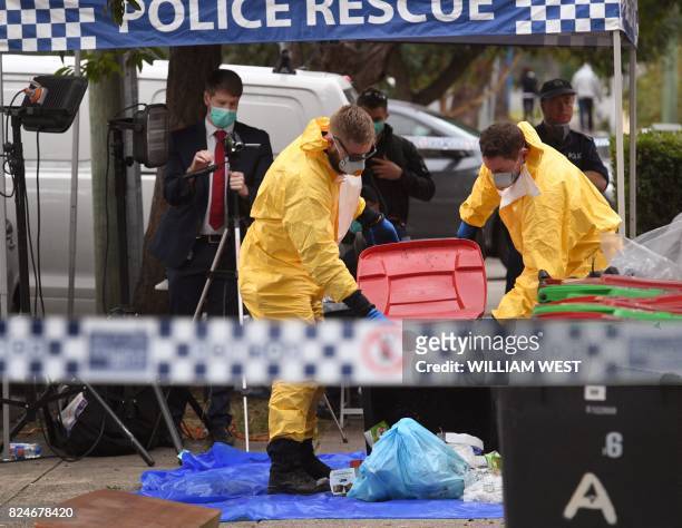 Police search for evidence at a block of flats in the Sydney suburb of Lakemba on July 31 after counter-terrorism raids across the city on the...