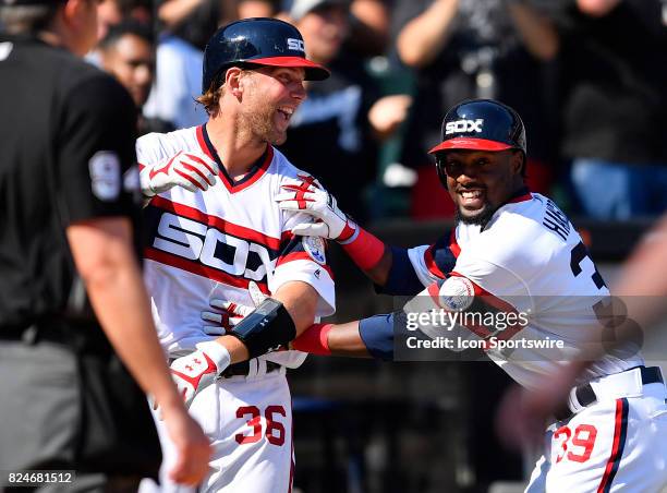 Chicago White Sox catcher Kevan Smith and Chicago White Sox second baseman Alen Hanson celebrates Chicago White Sox first baseman Matt Davidson walk...