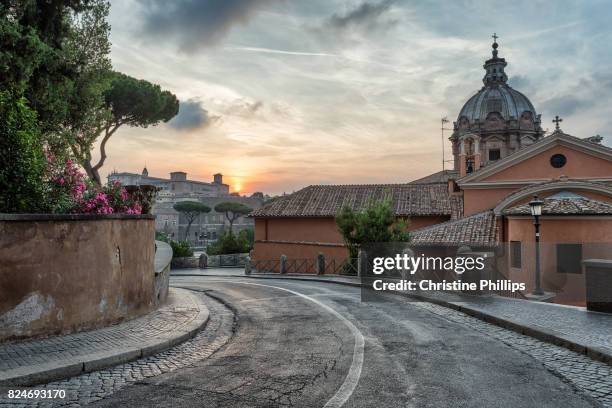 a street in rome at sunrise - rome sunset stock pictures, royalty-free photos & images