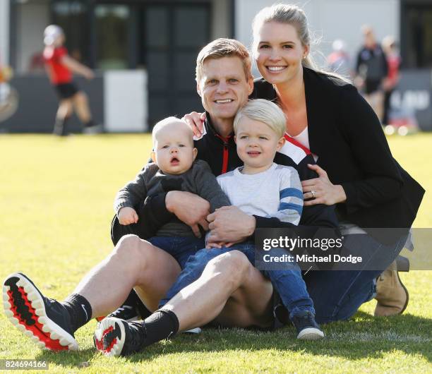 Nick Riewoldt poses with kids William and James and wife Catherine after announcing his retirement during a St Kilda Saints AFL press conference at...