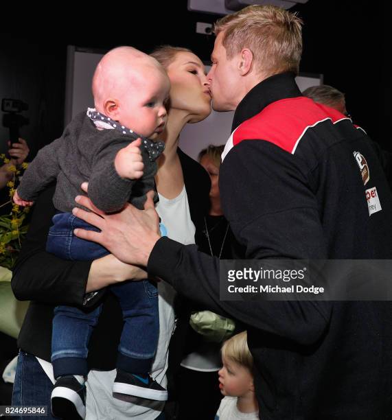 Nick Riewoldt kisses wife Catherine after announcing his retirement during a St Kilda Saints AFL press conference at Linen House Oval on July 31,...