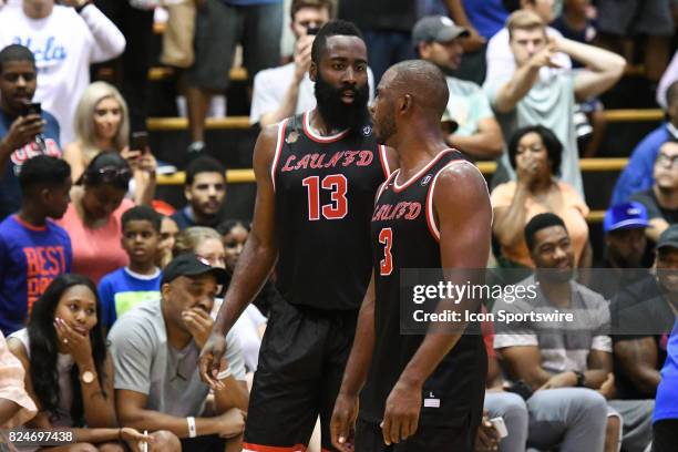 Houston Rockets guards James Harden and Chris Paul talk during a Drew League game at King Drw Magnet High School on July 30th, 2017.