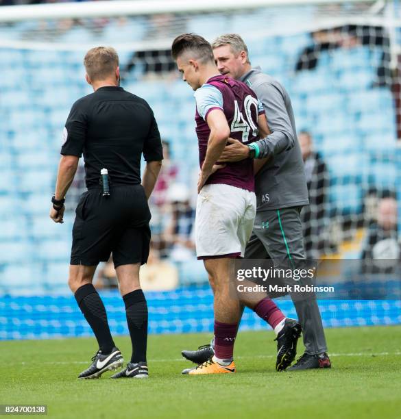 Jack Grealish of Aston Villa goes off injured in the 1st half during the pre season friendly match between Aston Villa and Watford at Villa Park on...