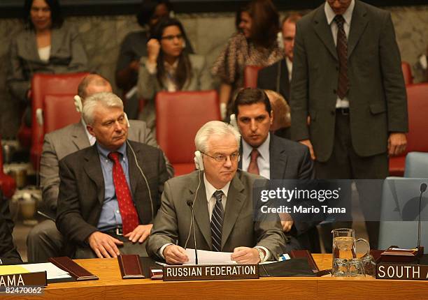 Vitaly Churkin , Ambassador of the Russian Federation to the United Nations, looks on with other Russian officials during a U.N. Security Council...