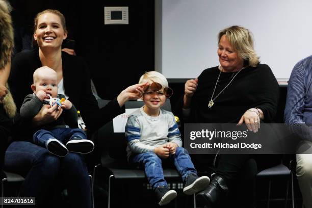 Nick Riewoldt's son James puts on mum Catherine Riewoldt's glasses next to Nick's mum Fiona and dad Joe as Nick Riewoldt announces his retirement...