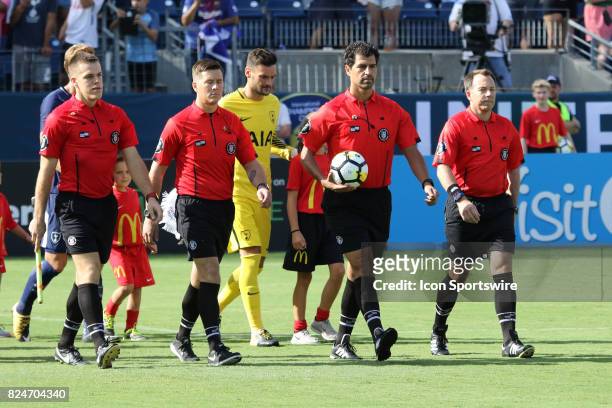 The referees lead the teams onto the field for the game between Manchester City and Tottenham Hotspur. Manchester City defeated Tottenham by the...