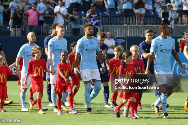 Teams march out for the game between Manchester City and Tottenham Hotspur. Manchester City defeated Tottenham by the score of 3-0. This...