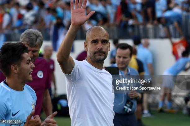 Manchester City head coach Pep Guardiola waves to the crowd following the game between Manchester City and Tottenham Hotspur. Manchester City...