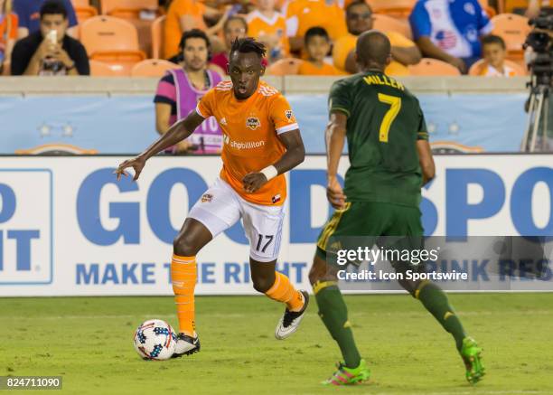 Houston Dynamo forward Alberth Elis dribbles past Portland Timbers defender Roy Miller during the MLS match between the Portland Timbers and Houston...