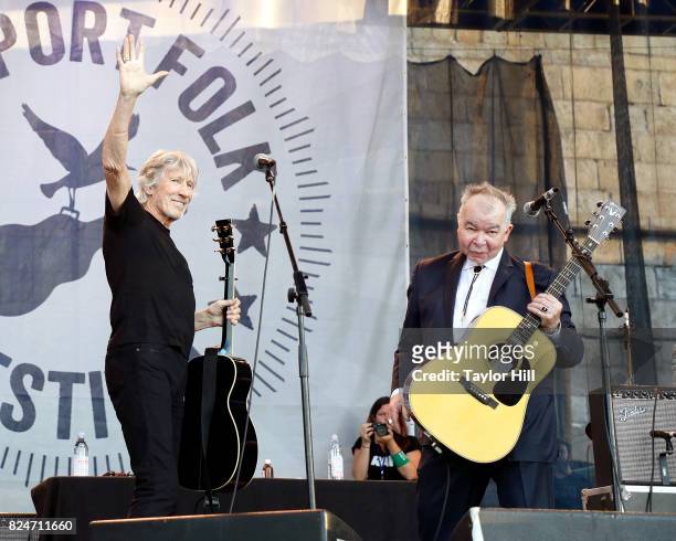 Roger Waters and John Prine perform during the 2017 Newport Folk Festival at Fort Adams State Park on July 30, 2017 in Newport, Rhode Island.