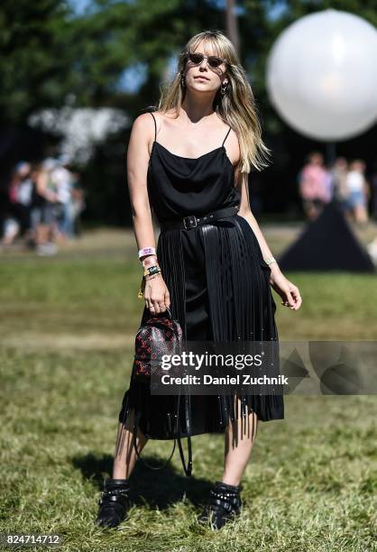 Lexi is seen wearing a Coach dress and YSL fringed leather skirt with Louis Vuitton bag during the 2017 Panorama Music Festival Day 3 at Randall's...