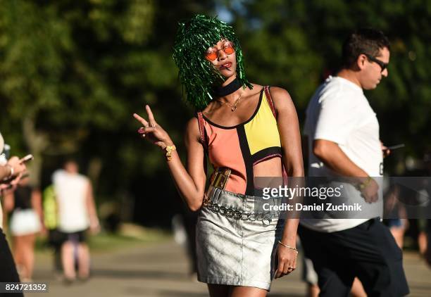 Festival goer is seen wearing a silver skirt and green wig during the 2017 Panorama Music Festival Day 3 at Randall's Island on July 30, 2017 in New...