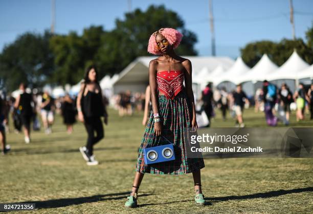 Mckenzie is seen wearing a bandana top, plaid skirt and boombox bag during the 2017 Panorama Music Festival Day 3 at Randall's Island on July 30,...