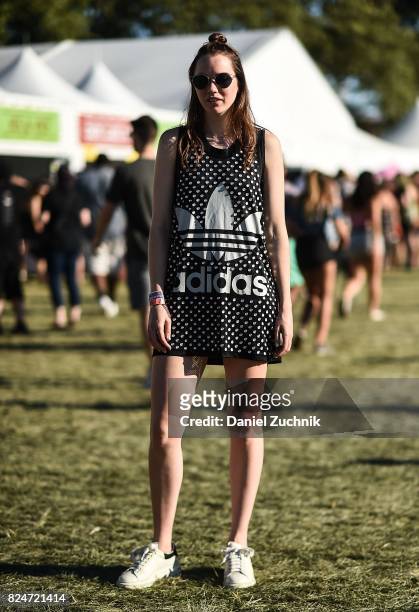 Festival goer is seen wearing a Jeremy Scott top during the 2017 Panorama Music Festival Day 3 at Randall's Island on July 30, 2017 in New York City.