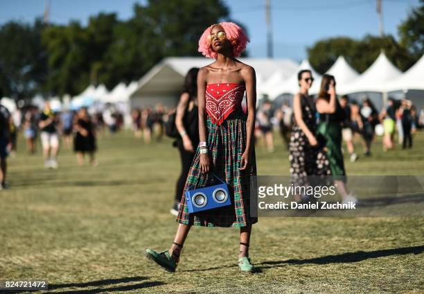Mckenzie is seen wearing a bandana top, plaid skirt and boombox bag during the 2017 Panorama Music Festival Day 3 at Randall's Island on July 30,...