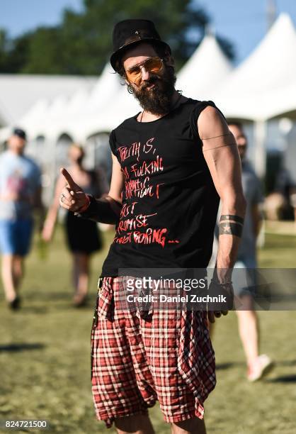 Festival goer is seen wearing Comme Des Garcons plaid shorts during the 2017 Panorama Music Festival Day 3 at Randall's Island on July 30, 2017 in...