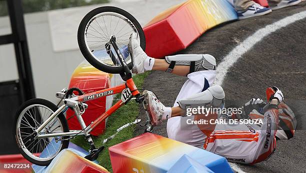 Raymon van der Biezen of the Netherlands crashes during the men's BMX quarterfinals at the Laoshan BMX Venue, in Beijing on August 20, 2008. AFP...