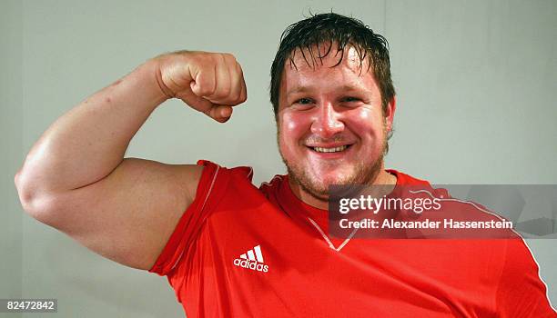 Matthias Steiner of Germany, gold medalist in the Weightlifting Men's 105 kg group, poses after a press conference at the Media Press Centre during...