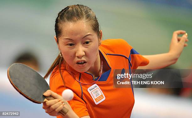 Netherland's table tennis player Li Jie plays against Austria's Liu Jia in their Women's singles table tennis preliminary round match at the 2008...