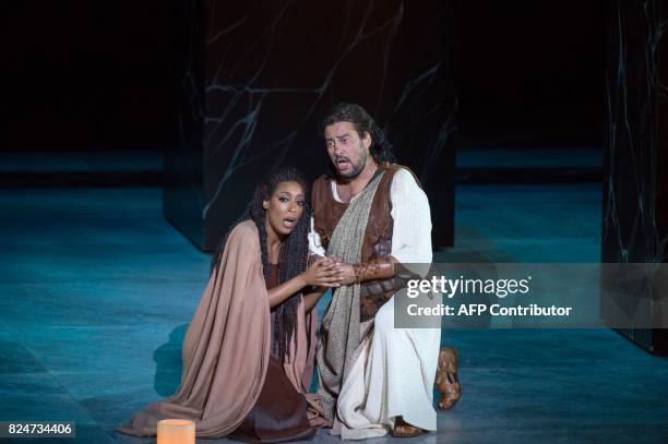 Argentinian tenor Marcelo Alvarez as Radames and US soprano Elena O'Connor as Aida perform the opera "Aida" by Giuseppe Verdi, on July 30, 2017 in...