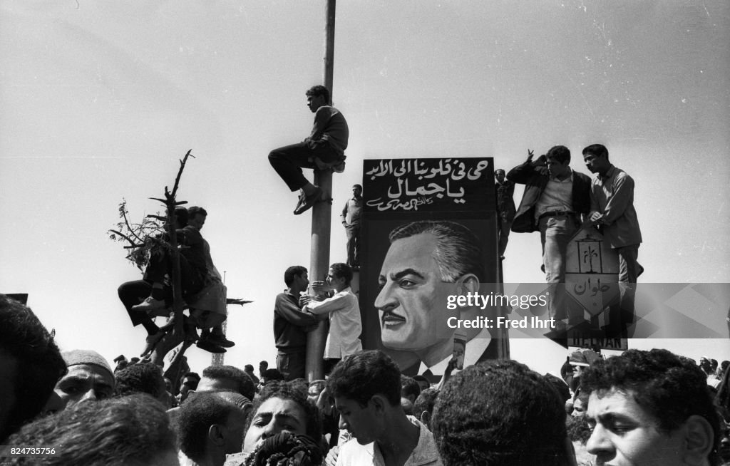 People all over the street of Cairo trying to get a last...