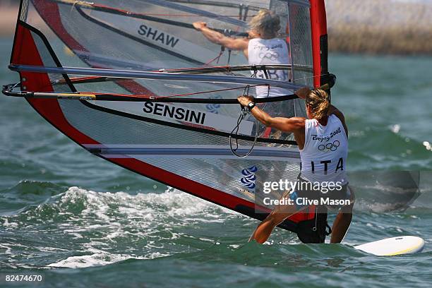 Alessandra Sensini of Italy and Bryony Shaw of Great Britain compete in the Women's RS:X class medal race held at the Qingdao Olympic Sailing Center...