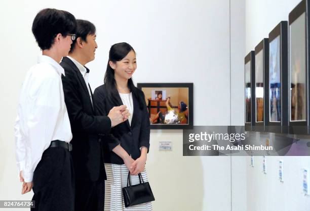 Prince Akishino and his second daughter Princess Kako visit the Sendai Mediatheque to see pictures of the award winners of the 41st All Japan High...