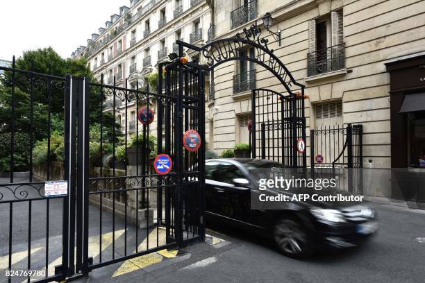 Vehicle passes through gates near the home of French actress Jeanne Moreau in Paris on July 31 after her death at the age of 89 was announced. French...