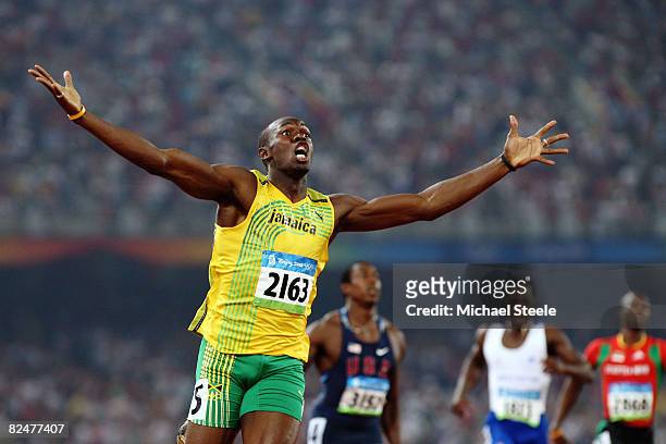 Usain Bolt of Jamaica reacts after breaking the world record with a time of 19.30 to win the gold medal in the men's 200m final during the track and...