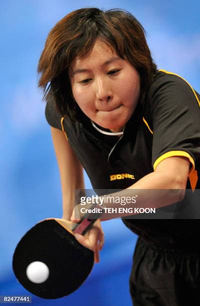 Dominican Republic's table tennis player Wu Xue plays against Singapore's Wang Yue Gu in their women's singles table tennis preliminary round match...