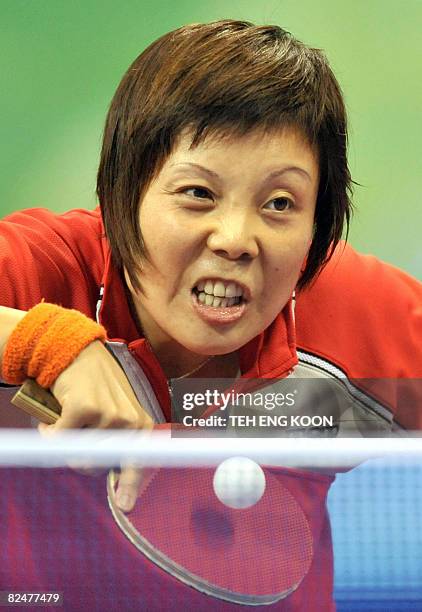 Singapore's table tennis player Wang Yue Gu plays against Dominican Republic's Wu Xue in their Women's singles table tennis preliminary round match...