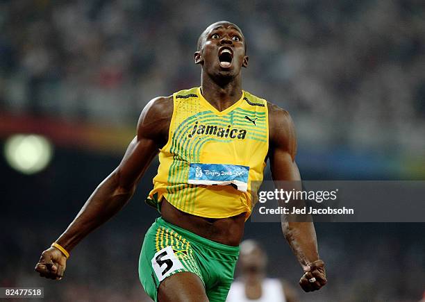 Usain Bolt of Jamaica reacts after breaking the world record with a time of 19.30 to win the gold medal in the Men's 200m Final at the National...