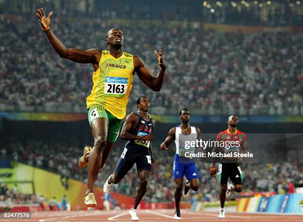Usain Bolt of Jamaica reacts after breaking the world record with a time of 19.30 to win the gold medal in the Men's 200m Final at the National...